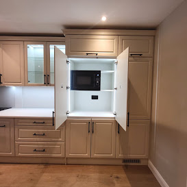 Cream shaker kitchen with an illuminated pantry cupboard