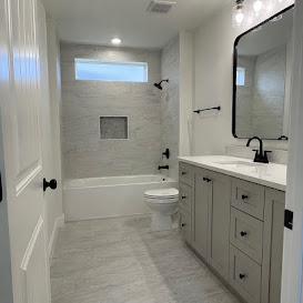 Bright tiled bathroom with fitted vanity
