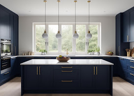 Navy kitchen with large island and gold pendant lights