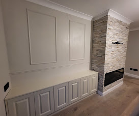 Panelled living room wall and fireplace