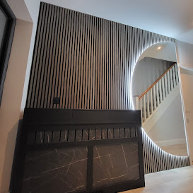 Timber slat feature wall and circular mirror